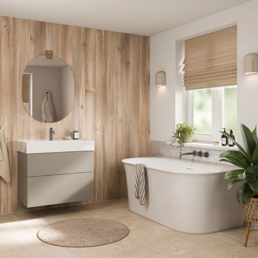 Lifestyle image of the Showerwall Laminate Weathered Pine 2440mm x 900mm Square Cut Hydrocore Wall Panel - SW105 behind a wall-hung vanity unit & basin with oval mirror